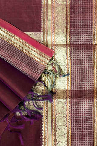 Rich wine and navy blue shot silk saree with gold zari elephant and peacock arch motifs on the pallu