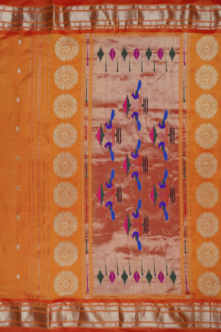 Orange Paithani silk saree with light gold buttis and a tissue pallu of circular chakra motifs with peacocks