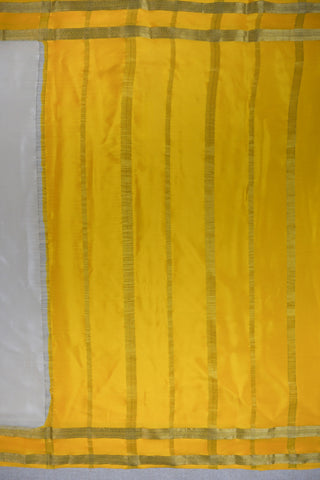 Draped off-white silk saree with a plain body, mustard yellow twin zari stripe border and yellow striped pallu