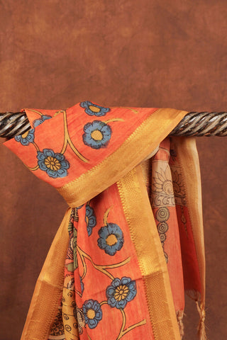 Rust orange Kalamkari saree with hand-painted floral vines, mythological figures and gold zari edging