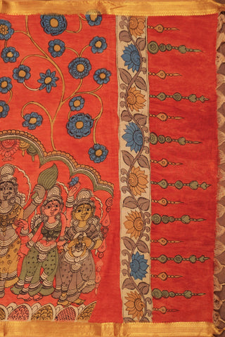 Rust orange Kalamkari saree with hand-painted floral vines, mythological figures and gold zari edging