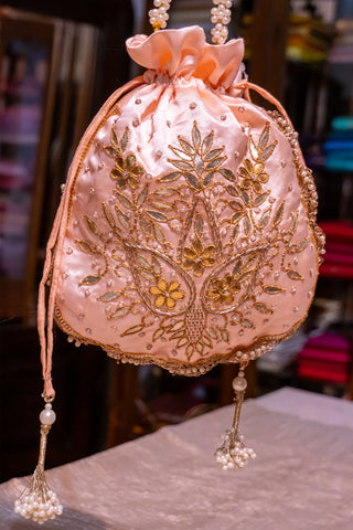 Golden Trails: Handcrafted Potli with Intricate Embroidery