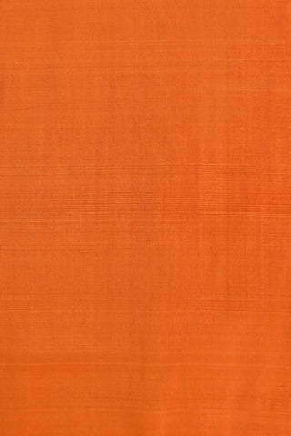 Orange Paithani silk saree with gold dot buttis and a lotus border, with red, purple and green tissue pallu