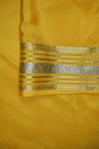 Off-white crepe silk saree with gold zari checks, mustard yellow paisley border and striped mustard pallu