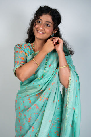 Aqua green Chanderi saree with peach floral prints