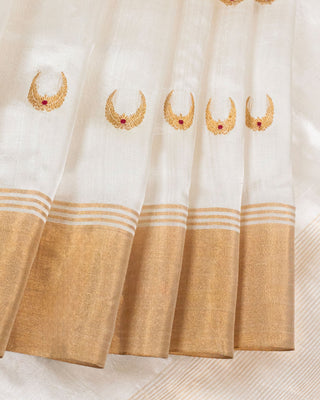 Off-white silk cotton Chanderi saree with gold zari chand motifs and red meenakari accents