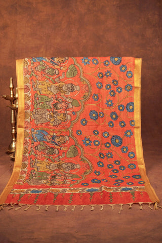 Rust orange Kalamkari saree with hand-painted floral vines, mythological figures and gold zari edging