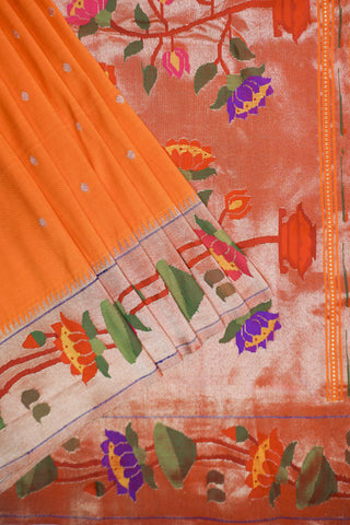 Orange Paithani silk saree with gold dot buttis and a lotus border, with red, purple and green tissue pallu