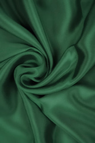 Bottle green crepe silk saree with paisley zari border