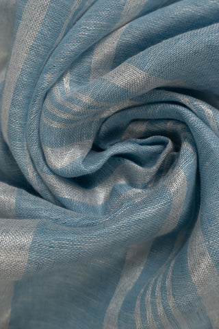 Pastel blue linen saree with contrast border and tassels