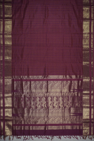 Deep magenta silk saree with mustard gold checks, antique gold elephant border and lion motif pallu