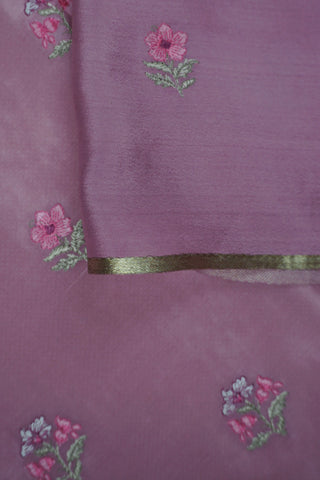 Magenta pink crepe silk saree with gold zari checks and pink-green floral thread embroidery on the pallu
