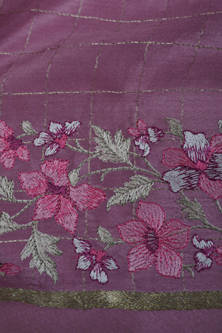 Magenta pink crepe silk saree with gold zari checks and pink-green floral thread embroidery on the pallu