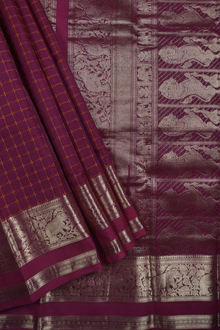 Deep magenta silk saree with mustard gold checks, antique gold elephant border and lion motif pallu