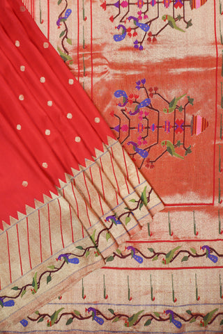 Red Paithani silk saree with gold buttis, tissue Muniya border and a pallu of parrots and peacocks on a tree