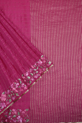 Lilac crepe silk saree with gold zari checks and pink, white and green floral vine embroidery on the borders