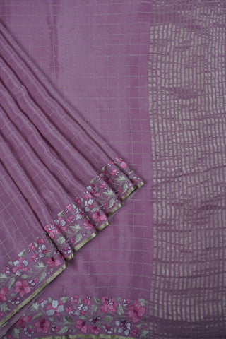 Magenta pink crepe silk saree with gold zari checks and pink-green floral thread embroidery on the pallu