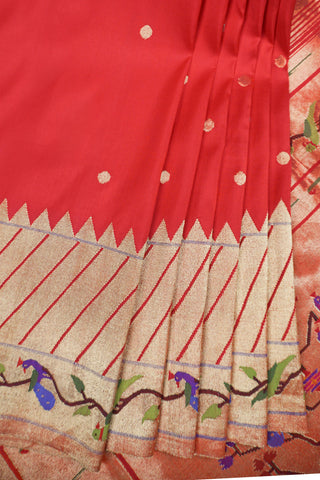 Red Paithani silk saree with gold buttis, tissue Muniya border and a pallu of parrots and peacocks on a tree