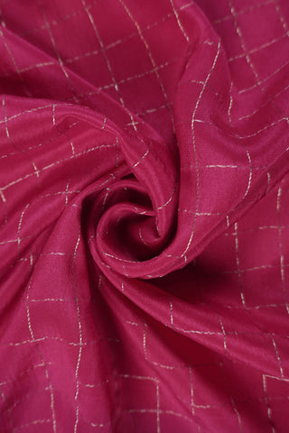 Lilac crepe silk saree with gold zari checks and pink, white and green floral vine embroidery on the borders