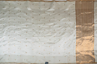 Off-white pure silk Chanderi saree with gold zari floral phool butis and tissue pallu