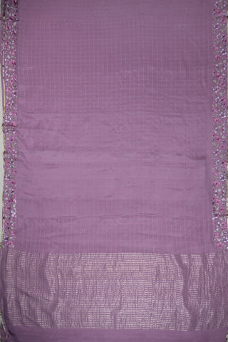 Magenta pink crepe silk saree with gold zari checks and pink-green floral thread embroidery on the pallu