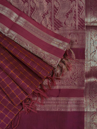 Deep magenta silk saree with mustard gold checks, antique gold elephant border and lion motif pallu