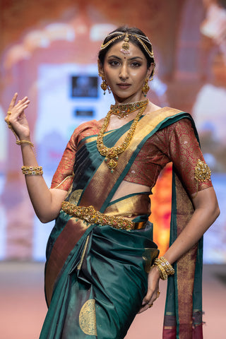 Bottle green Kanjivaram silk saree with gold zari border