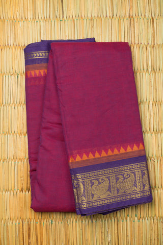 Rani pink and purple dhoop-chaon Chettinad cotton saree with gold zari peacock border motif