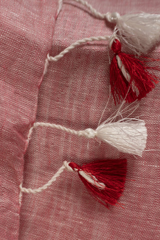 Coral pink linen saree with silver stripes and red border