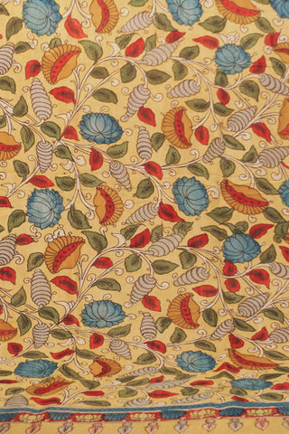 Muted mustard yellow Kalamkari dupatta with hand-drawn blue and red flowers, winding vines and rust-orange woven border