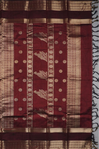 Deep maroon Kanchi silk saree with scattered gold zari bird motifs and a double Rettai Pattu border