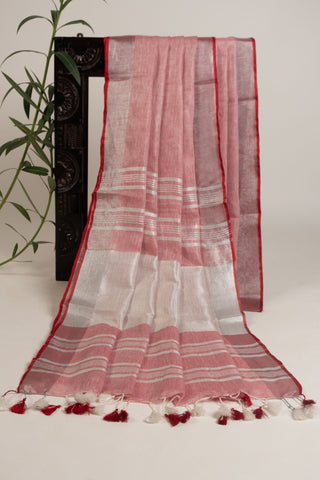Coral pink linen saree with silver stripes and red border