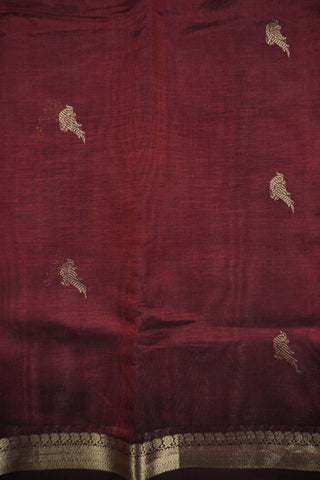 Deep maroon Kanchi silk saree with scattered gold zari bird motifs and a double Rettai Pattu border
