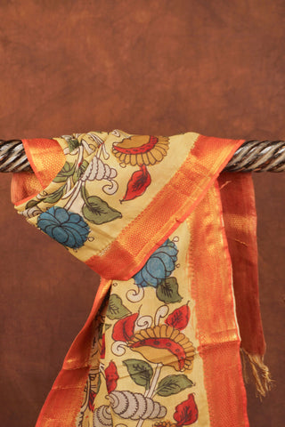 Muted mustard yellow Kalamkari dupatta with hand-drawn blue and red flowers, winding vines and rust-orange woven border