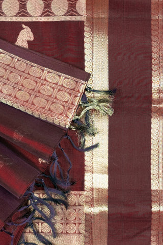 Deep maroon Kanchi silk saree with scattered gold zari bird motifs and a double Rettai Pattu border