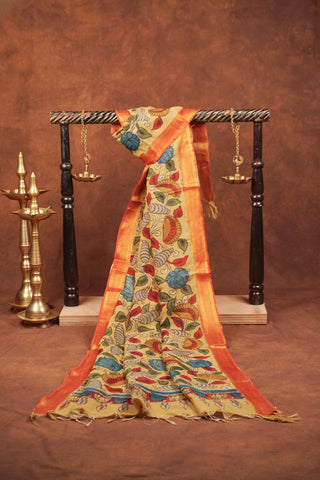 Muted mustard yellow Kalamkari dupatta with hand-drawn blue and red flowers, winding vines and rust-orange woven border