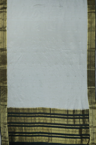 Ivory silk saree with gold pinstripes, a black zari lattice border with temple edges and a black striped pallu