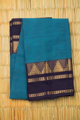 Teal blue Chettinad cotton saree with navy blue and gold woven border and subtle stripes