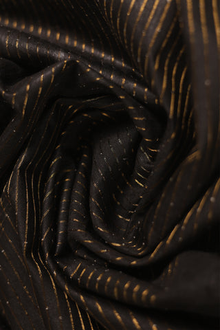 Luxe black linen saree with gold zari stripes and tassel pallu