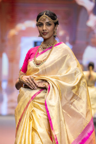 Gold Kanjivaram silk saree inspired by Athiya Shetty with pink border