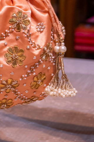 Peach Pearl Potli: Handcrafted Elegance for Celebrations