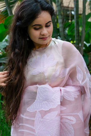 Light pink pure silk organza saree with floral applique work and scalloped border.
