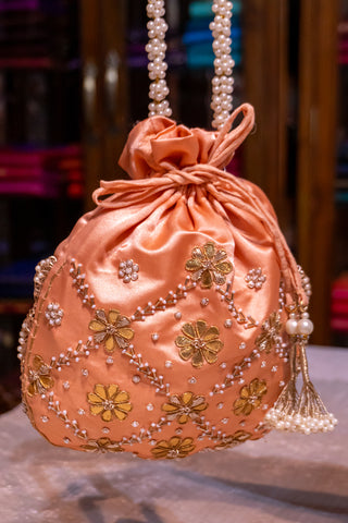 Peach Pearl Potli: Handcrafted Elegance for Celebrations