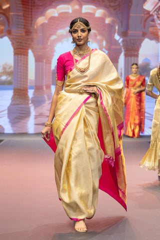 Gold Kanjivaram silk saree inspired by Athiya Shetty with pink border