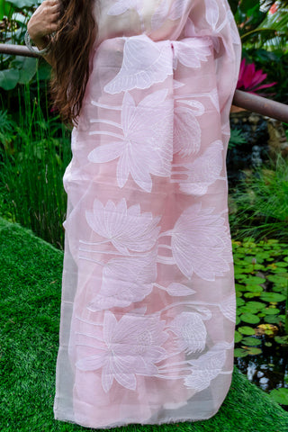 Light pink pure silk organza saree with floral applique work and scalloped border.
