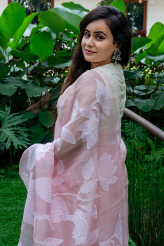 Light pink pure silk organza saree with floral applique work and scalloped border.