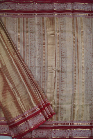 Golden olive green and bronze shot silk cotton saree with maroon border woven with elephant and peacock motifs