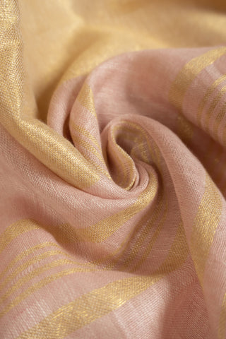 Blush pink linen saree with gold zari border and tassels