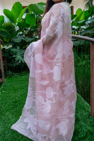 Light pink pure silk organza saree with floral applique work and scalloped border.