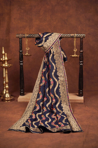 Navy blue silk dupatta with wavy gold zari leheriya stripes, pink and orange meenakari vines and gold kiran lace edging